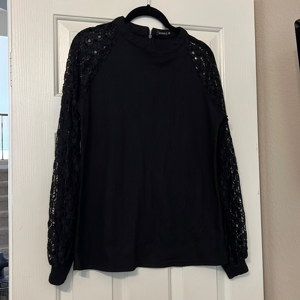 NWOT Black long sleeve sweater size medium with sleeve detail.